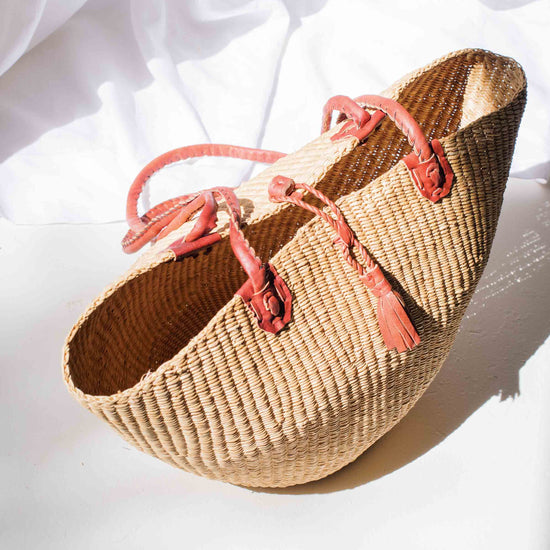 Woven shoes with pink laces on a white background