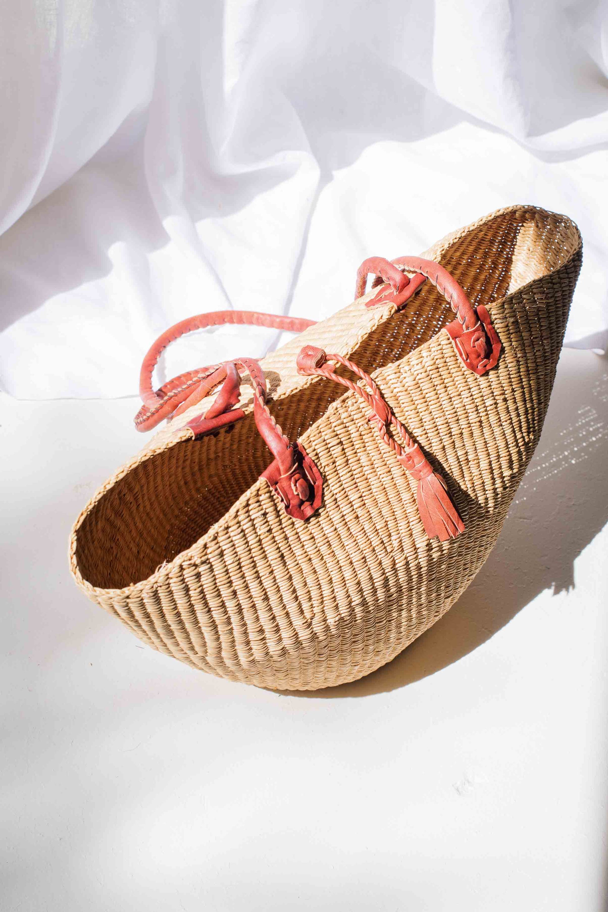 Woven shoes with pink laces on a white background